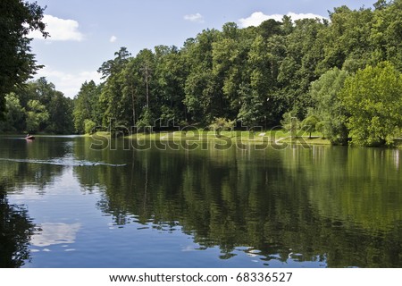 Summer landscape with lake and forest on banks, recorded in park Tsaritsino in Moscow.