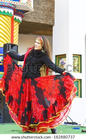 MOSCOW - MARCH 1 2014: maslenitsa (pancake week, shrovetide) - carnival of farewell winter and meeting spring in Moscow, gypsy artists dancing on open street stage.