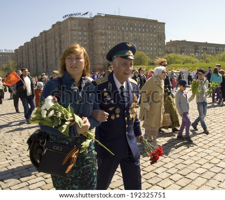 MOSCOW - MAY 9, 2014: Holiday Victory Day devoted to victory in Second World War, war veteran on the street.