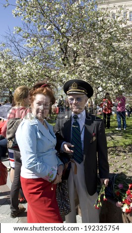 MOSCOW - MAY 9, 2014: Holiday Victory Day devoted to victory in Second World War, war veteran on the street.