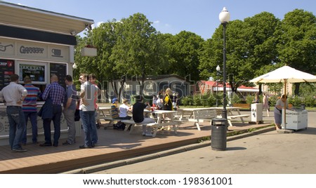 MOSCOW - MAY 23, 2014: moscovites and city visitors rest in Gorky park in summer. Park located in centre of the city has been founded in 1928, named by famous Russian writer Maxim Gorky in 1932.