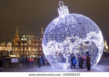 MOSCOW - DECEMBER 24, 2014: Christmas installation on Manezhnaya square, Historical museum and Kremlin towers.