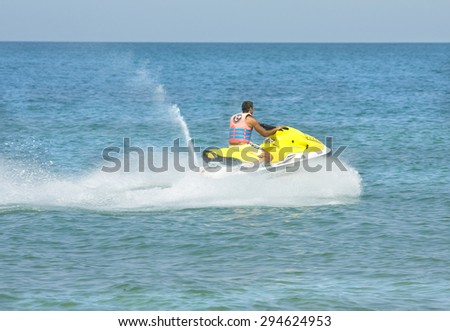 SAINT CONSTANTINE AND SAINT HELEN, BULGARIA - JULY 01, 2014: tourist on moto boat. the oldest resort of Bulgaria exist from 1908 year, provides wide range of equipment for water sports.