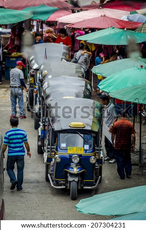 CHIANGMAI,THAILAND - 19 JULY,2014 :The auto rickshaw, called tuk-tuk  or sam-lor  meaning three-wheeler in Thailand, is a widely used form of urban transport in Bangkok and other Thai cities.