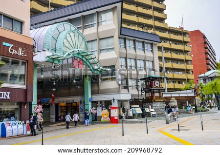 MATSUYAMA,JAPAN - 10 , April,2014 :In Matsuyama shopping arcade , most shops here open into the night and the shopping street remains lively with strolling visitors and ryokan guests in their yukata.
