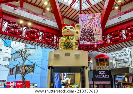 NAGOYA,JAPAN - 13 April,2014:The maneki-neko (welcoming cat) is a common Japanese figurine , usually made of ceramic in modern times, which is often believed to bring good luck to the owner.