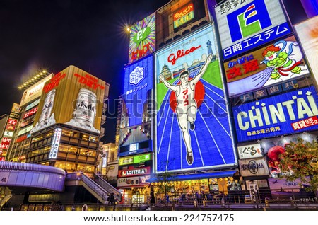 OSAKA,JAPAN - 18 April,2014 :The famous Glico man neon sign in Dotonbori , a popular nightlife and entertainment area characterized by its eccentric atmosphere and large illuminated signboards.