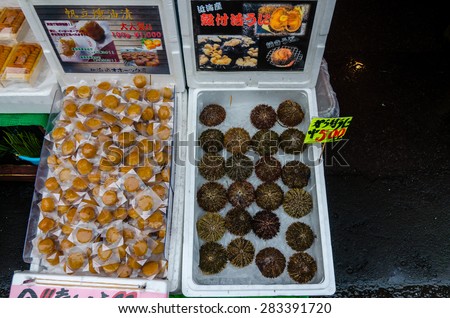 HAKODATE,JAPAN - 8 May 2014:The Hakodate Morning Market \'s products on sale include various types of fresh seafood such as crabs (kani), salmon eggs (ikura) and sea urchin (uni).