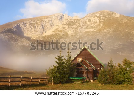 Mountain cottage at the foot of mountain