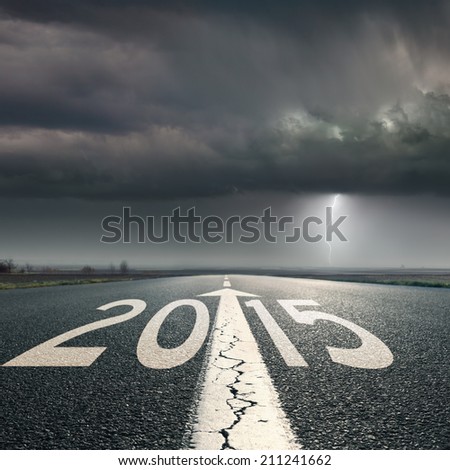 Driving on an empty road towards the lighting storm to upcoming 2015