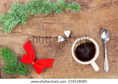 Cup of coffee with christmas decoration - retro style from above. Sugar cubes in the shape of heart symbolizing love