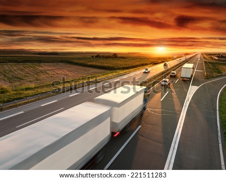Truck in motion blur on the highway at sunset