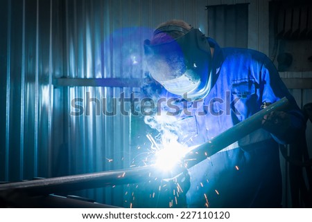 welder working with electrode
