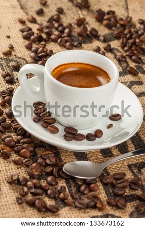 Espresso, coffee cup, spilled coffee beans