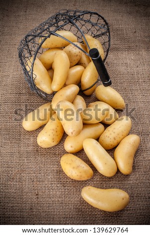 Basket of potatoes on hemp bag