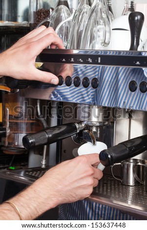 Coffee machine preparing cup of coffee, process of preparation of coffee