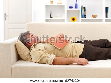 Senior man felt asleep while reading book