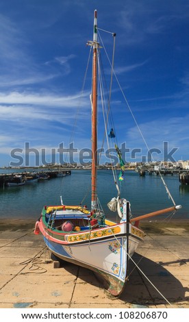 Small yacht  in Portimao harbor in Algarve, Portugal