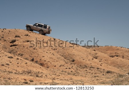 4x4 vehicle driving off-roads in steppe, Kazakhstan