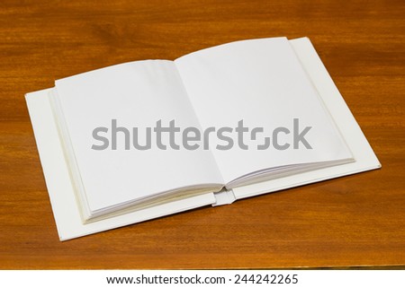 Blank note book paper on wood floor