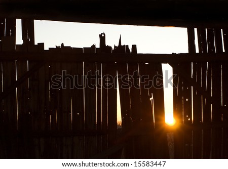 sunset seen from inside barn