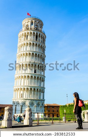 PISA, ITALY- MAY 10: Tourists visiting the amazing world heritage site of leaning Pisa tower in Pisa, Tuscany of Italy on May 10, 2015.