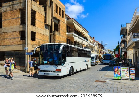 OLIMPIA, GREECE - JUNE 10: The buses transferring many tourists to visit The ancient Olympia on June 10, 2015 in Olympia, Greece. Many tourists visiting the birth place of Olympic games every year.