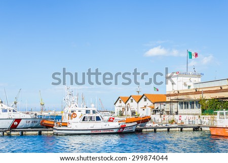 PALERMO, SICILY, ITALY- APRIL 10: Italian coast guard boats parked at coast guard building in old port of Palermo, Sicily on April 10, 2015. Coast guard is commonly known as the Guardia costiera.