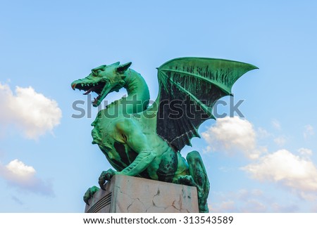 LJUBLJANA, SLOVENIA- AUGUST 30: Famous Dragon statue on Dragon's bridge in Ljubljana, capital of Slovenia on August 30, 2015.