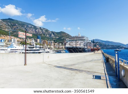 MONTE CARLO, MONACO- AUGUST 17: Port and city view of Monte Carlo, Monaco on August 17, 2015. Monte Carlo, where the Monte Carlo Casino is located and the Formula 1 Monaco Grand Prix takes place.