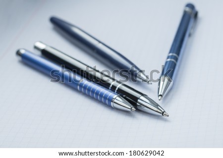 Metal tip pen on a white background.Macro image with shallow depth of focus.