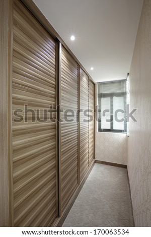 sliding doors wardrobe furnishing in small room.