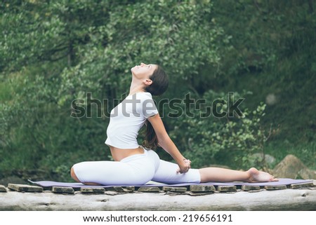 Woman  doing yoga in nature