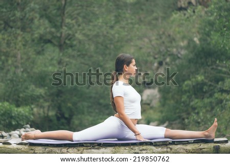 Woman doing yoga in nature.