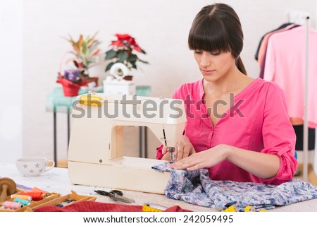 Woman sewing at home.