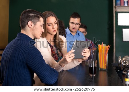 Young couple using Computer Tablet