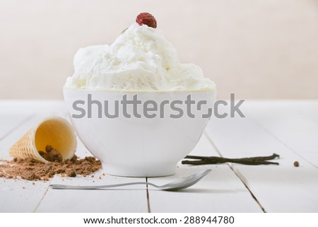 Vanilla Ice Cream on white wooden table. Selective focus and small depth of field .