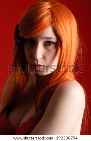 Beautiful young girl with red-orange hair