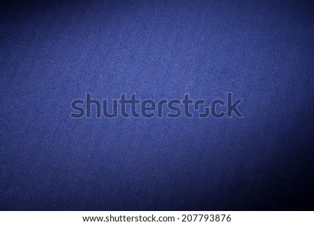 Dark blue background of canvas vintage background texture - black on border with light center