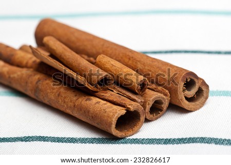 Spices. Cinnamon sticks on a kitchen towel. Shallow depth of field