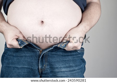 Fat man with a big belly wearing jeans