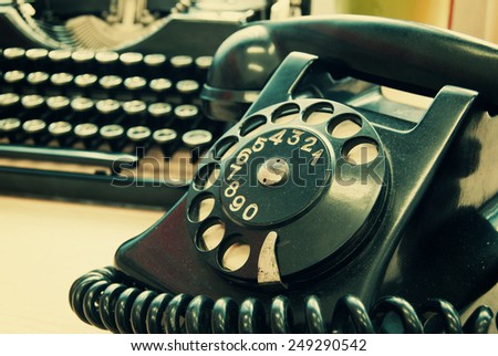 Vintage phone and old typewriter - vintage photo effect