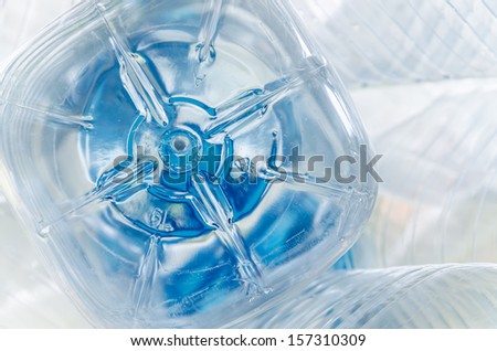 The bottom of empty plastic water container with recycle sign  closeup
