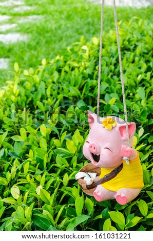 smile pig made of ceramic decorating in the garden