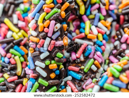 crispy sweet straw covered chocolate with colorful sugar sprinkles