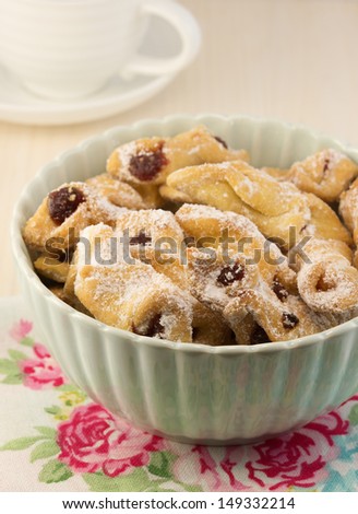 Bowl with traditional grandmother\'s christmas holiday homemade cookies with jam on the wooden tray. Christmas dessert.