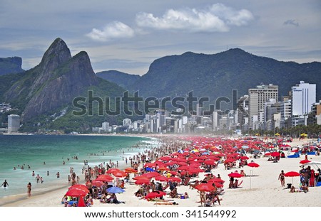 Rio de Janeiro, Brazil - January 06, 2011: People gathered on famous Ipanema Beach for sun tanning and swimming. Ipanema is one of the best beach on Atlantic coast of Brazil.