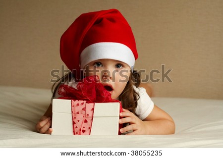 Christmas little girl with a goody bag