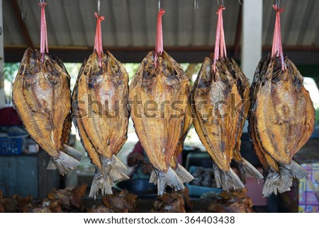 Dried fish hung in front of a fish shop