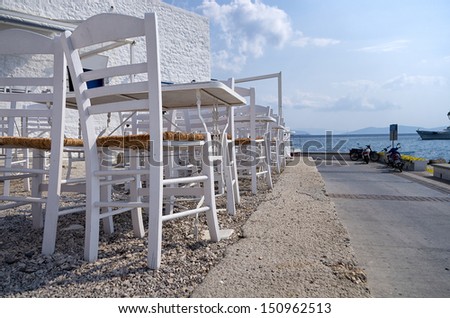 Tables and chairs of a tavern in Spetses island, Greece